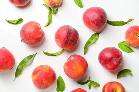 Sweet ripe peaches on white backgroundの写真素材