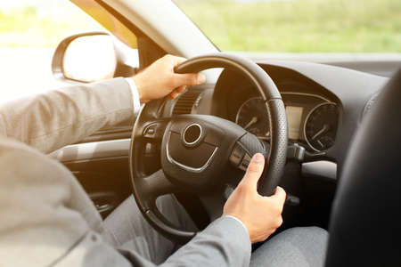 Successful businessman driving modern car