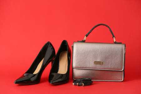 Stylish bag and shoes on color backgroundの写真素材