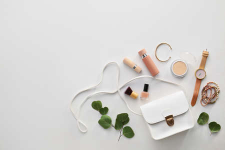 Stylish bag, accessories and cosmetics on light backgroundの写真素材