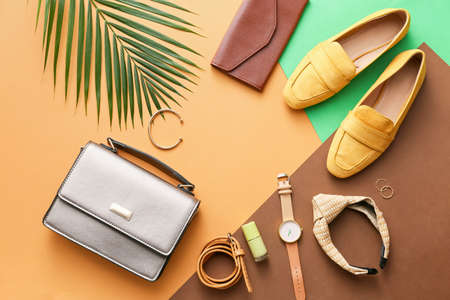 Stylish bag and accessories on color backgroundの写真素材