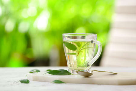 Cup of green tea on blurred backgroundの写真素材