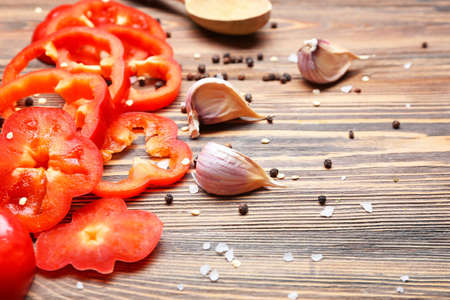 Sliced red bell pepper on wooden tableの写真素材
