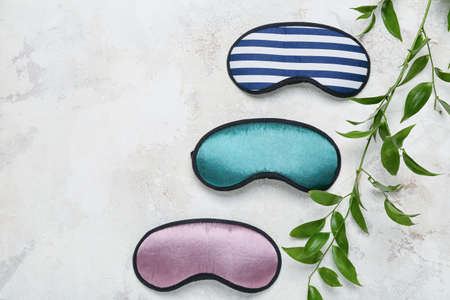 Sleeping masks on light background