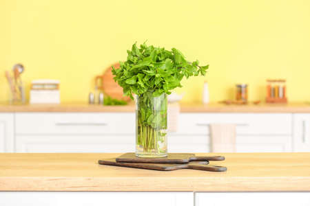 Glass with fresh mint on table in kitchenの写真素材