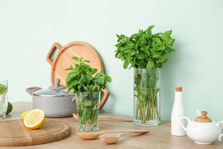 Fresh mint and citruses on kitchen tableの写真素材
