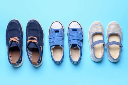 Child's shoes on color backgroundの写真素材