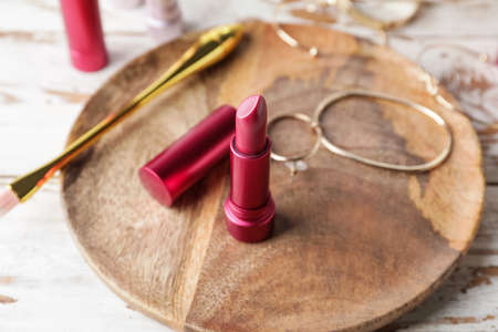 Different lipsticks and bijouterie on tableの写真素材