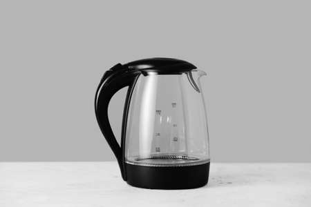 Transparent electric kettle on tableの写真素材