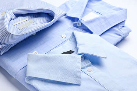 New man shirts on light background, closeupの写真素材
