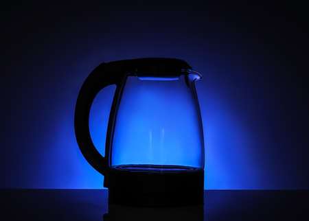 Transparent electric kettle on color backgroundの写真素材