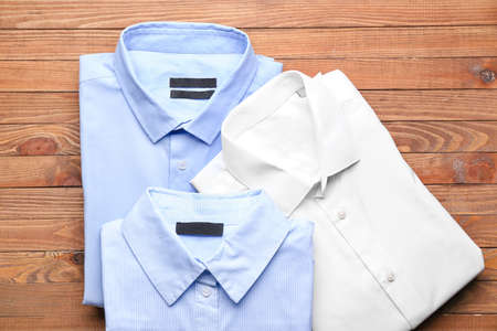 New man shirts on wooden backgroundの写真素材