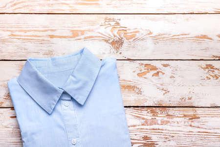 New male shirt on wooden backgroundの写真素材