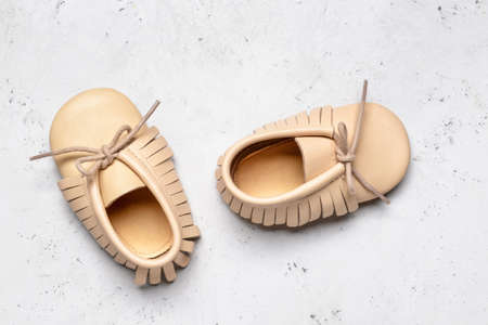 Baby shoes on light backgroundの写真素材