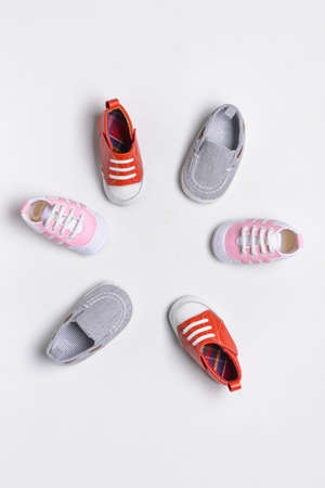 Baby shoes on white background
