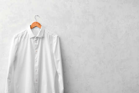 Stylish male shirt on on light backgroundの写真素材