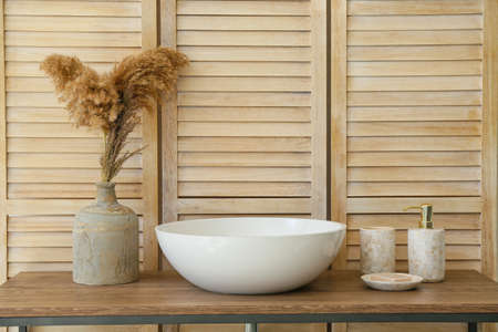 Body care cosmetics near sink in bathroomの写真素材