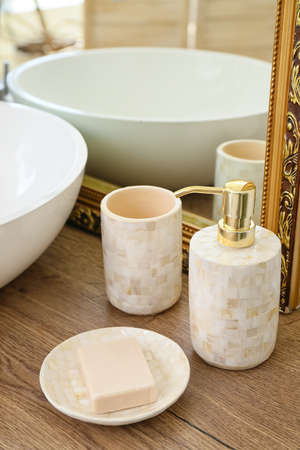 Body care cosmetics near sink in bathroom