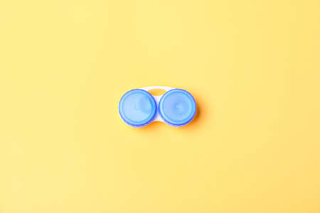 Container with contact lenses on color backgroundの写真素材