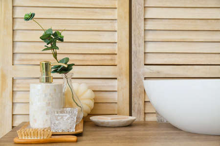 Body care cosmetics near sink in bathroom