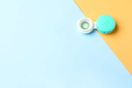 Container with contact lenses on color backgroundの写真素材