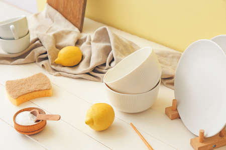Dishware with natural detergents on kitchen tableの写真素材