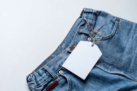 Stylish jeans pants on white backgroundの写真素材