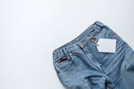 Stylish jeans pants on white backgroundの写真素材