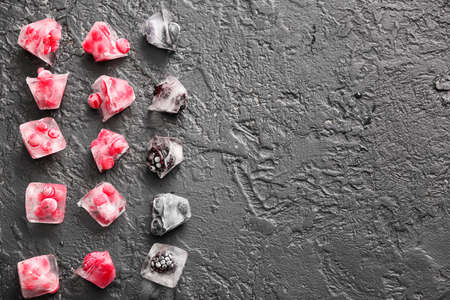 Ice with frozen berries on dark backgroundの写真素材