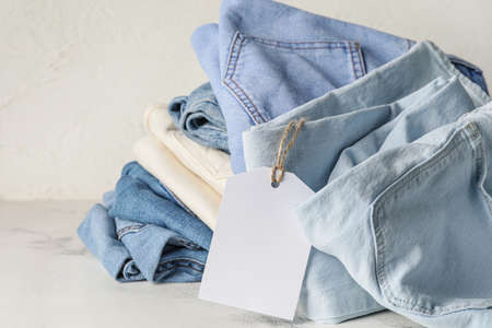 Stylish jeans pants on white backgroundの写真素材