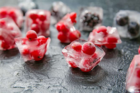 Ice with frozen berries on dark backgroundの写真素材