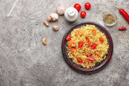 Plate with tasty pilaf on gray backgroundの写真素材