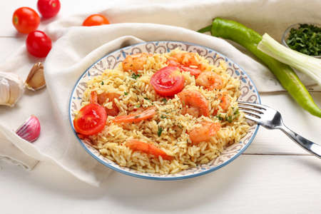 Plate with tasty pilaf on tableの写真素材