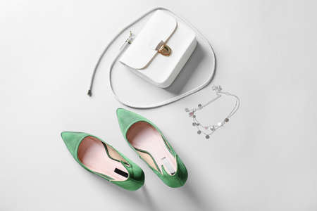 Female shoes and accessories on white background