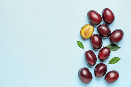 Tasty sweet plums on color backgroundの写真素材