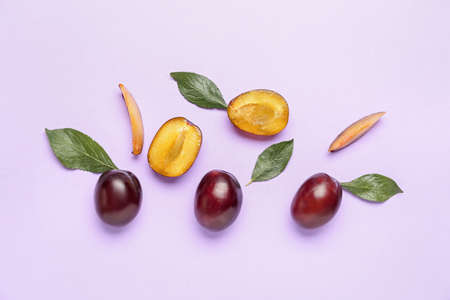 Tasty sweet plums on color backgroundの写真素材