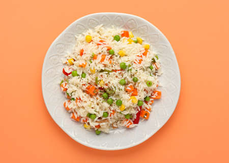 Plate with tasty pilaf on color backgroundの写真素材