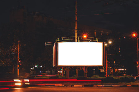 Advertising billboard at night outdoorsの写真素材