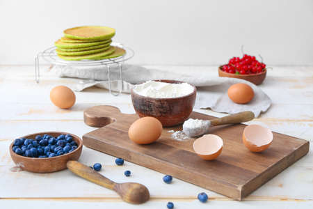 Ingredients for tasty green pancakes on tableの写真素材