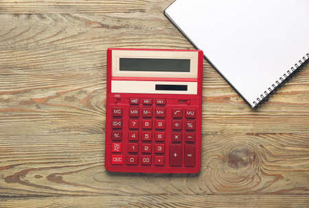 Modern calculator and stationery on wooden backgroundの写真素材
