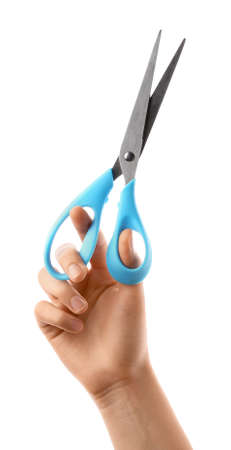 Woman with scissors on white background