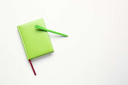 Notebook and pen on white backgroundの写真素材