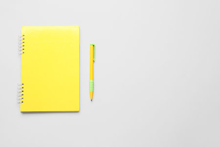 Notebook and pen on light backgroundの写真素材