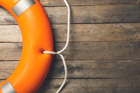 Lifebuoy on wooden background, closeupの写真素材
