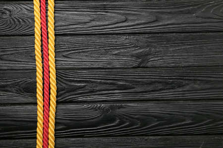 Ropes on dark wooden backgroundの写真素材