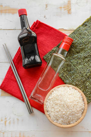 Composition with rice vinegar on wooden backgroundの写真素材