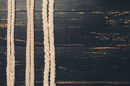 Long ropes on wooden backgroundの写真素材