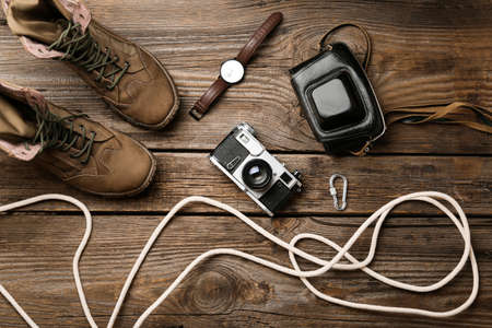 Set of travel items with rope on wooden backgroundの写真素材