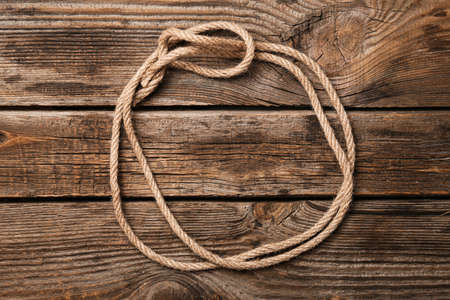 Frame made of rope on wooden backgroundの写真素材