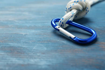Rope with lobster clasp on color background